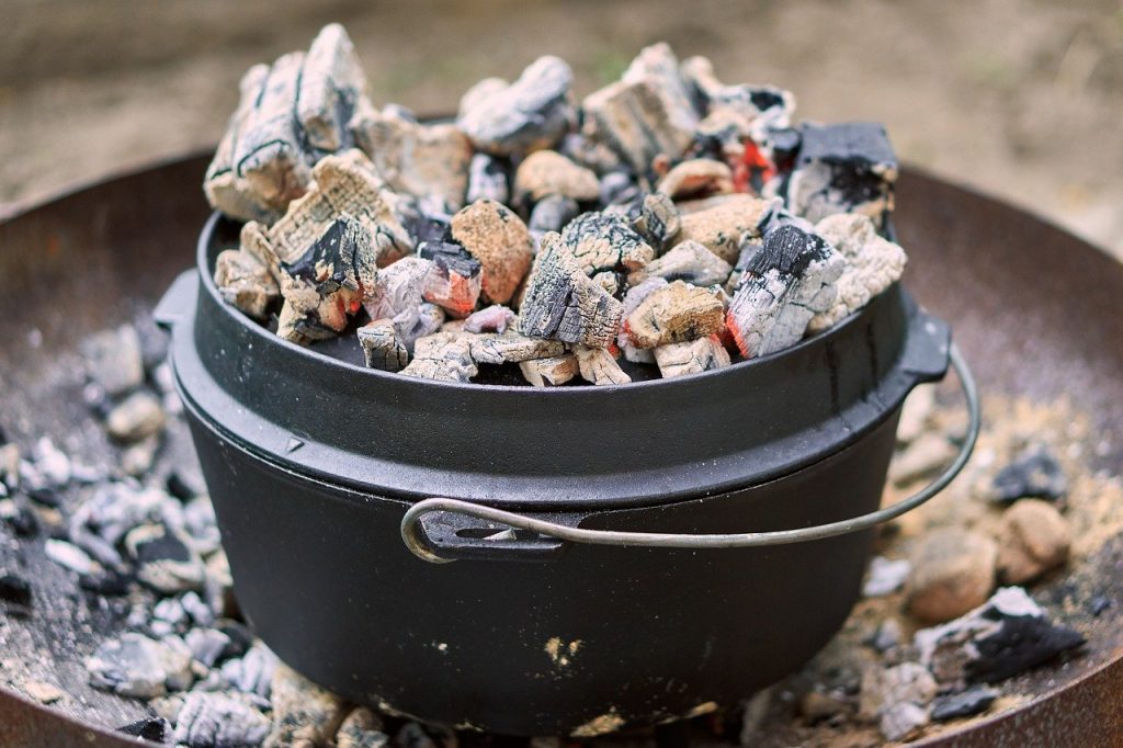 Dutch oven cooking over campfire